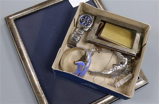 Two silver mounted photograph frames, two wrist watches and minor jewellery.